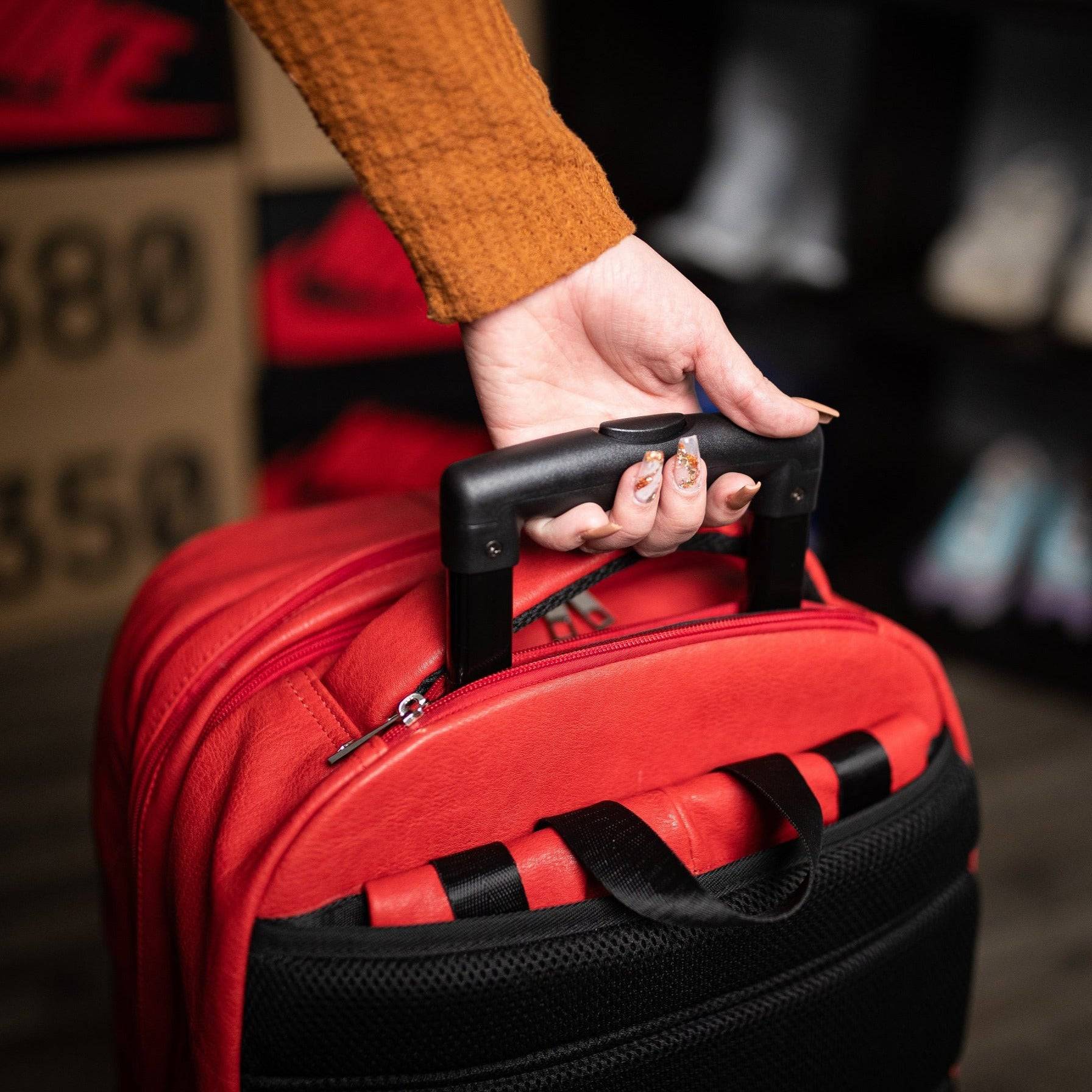 Red Leather Carry-On Roller Bag